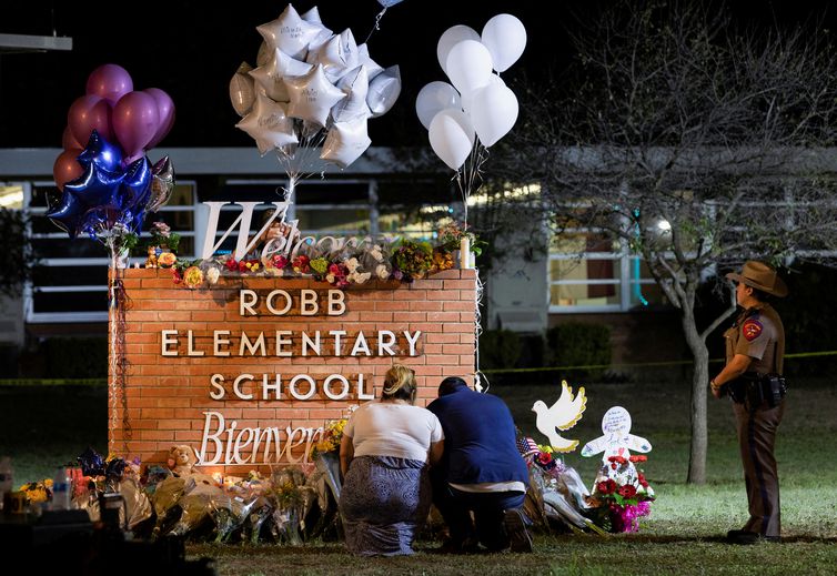 People react after a mass shooting at Robb Elementary School in Uvalde