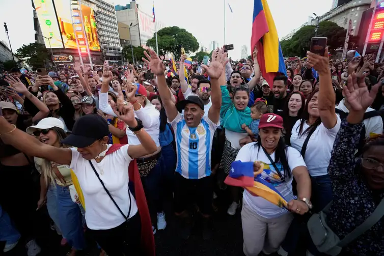 People celebrate following a U.S. strike on Venezuela, where President Nicolas Maduro and his wife, Cilia Flores, were captured, in Buenos Aires, Argentina, January 3, 2026. REUTERS/Mariana Nedelcu
