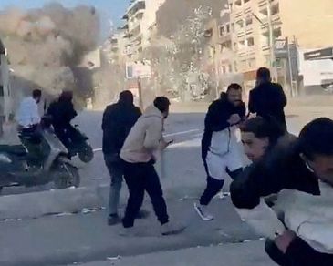 People run as a missile hits a building, following an escalation between Hezbollah and Israel amid the U.S.-Israel conflict with Iran, in Tyre, Lebanon, in this screen grab obtained from a social media video released March 2, 2026. Social Media/via REUTERS  THIS IMAGE HAS BEEN SUPPLIED BY A THIRD PARTY. MANDATORY CREDIT. NO RESALES. NO ARCHIVES. 

Verification: 
-Buildings, shopfronts, road layout and petrol station matched file and satellite imagery
-Exact time could not be verified
-However, Israel said it launched a wave of strikes in southern Lebanon on Monday (March 2)
-No older versions of the video found before Monday (March 2)